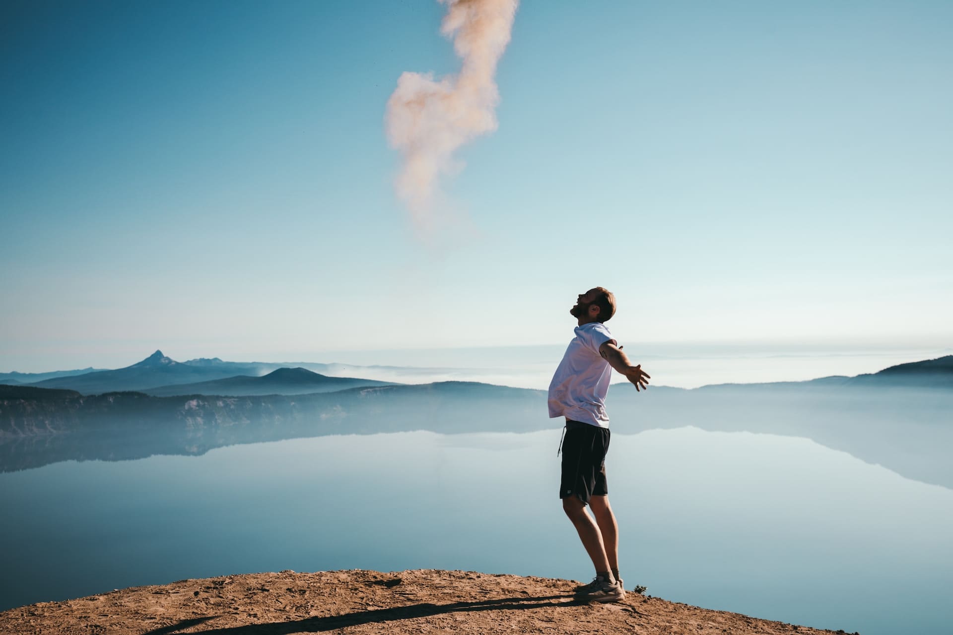 Image shows a man with arms outstretched in joy to illustrate the excitement authors should feel knowing that IngramSpark removed setup and revision charges.