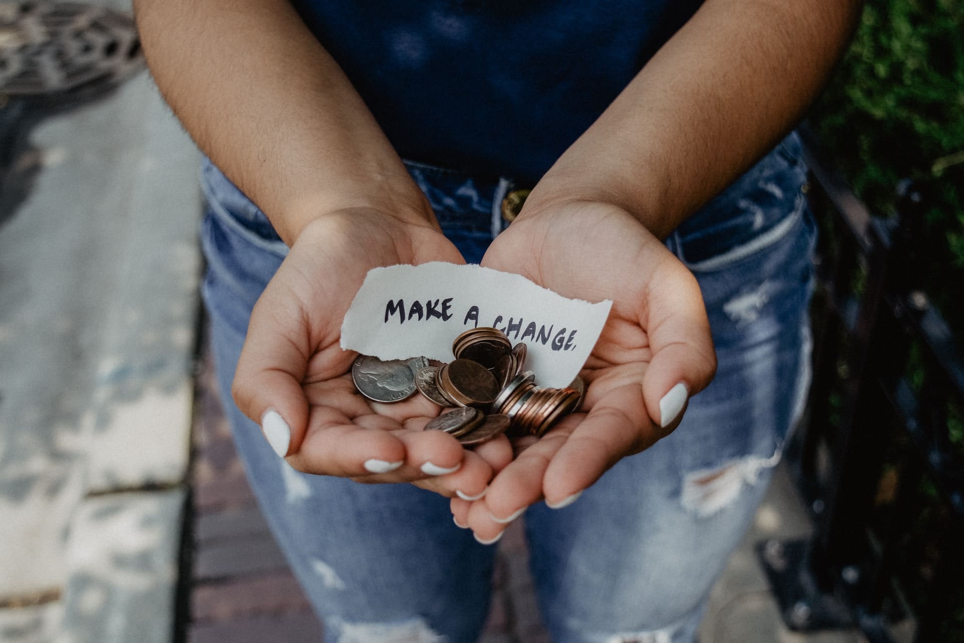Image shows two hands holding change and a note that reads "Make change" to illustrate that authors use Kickstarter - but should they?