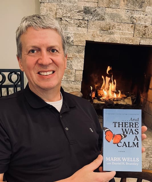 Mark Wells And There Was a Calm Mark Wells holds a copy of ...And There Was a Calm, his Christian book published by Argyle Fox Publishing