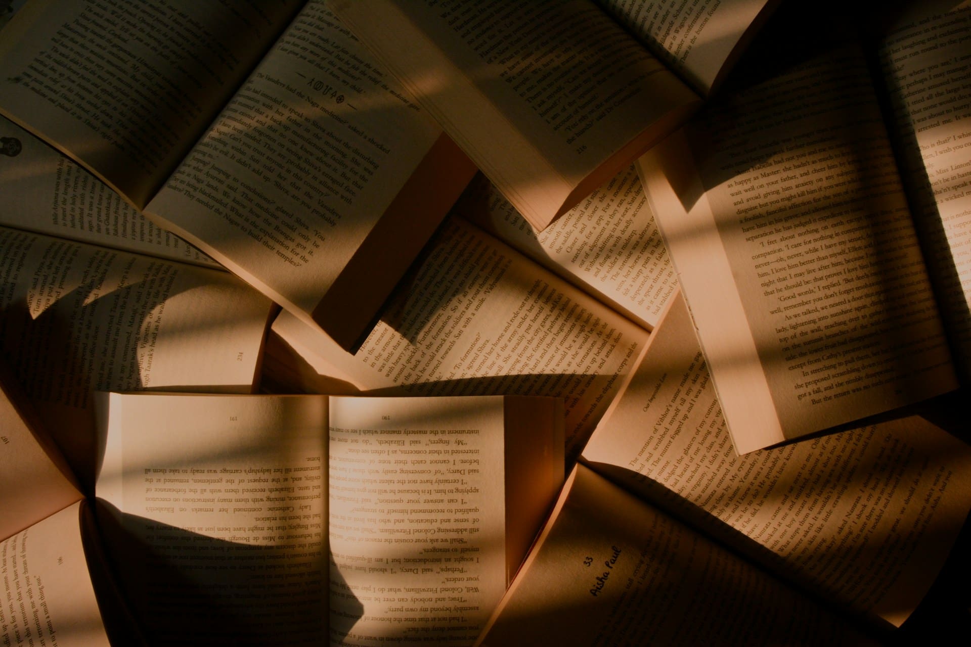 Books lie on top of each other to illustrate the topic of publishing words you should know.